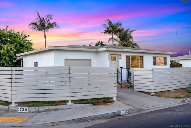 view of front of property featuring a garage