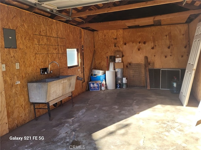 garage with sink and wood walls