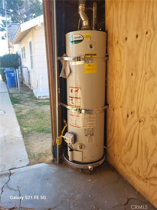 utility room with strapped water heater