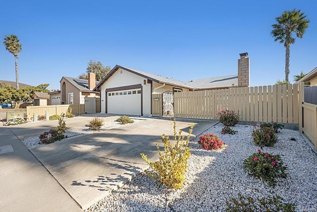 ranch-style home featuring a garage