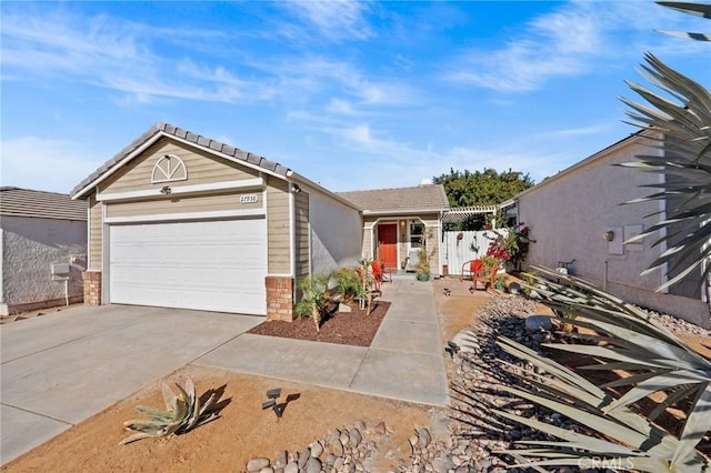 ranch-style home featuring a garage