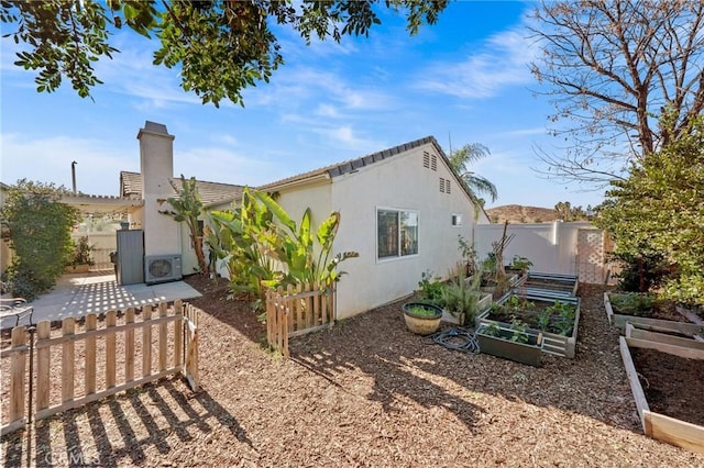 view of side of property with ac unit