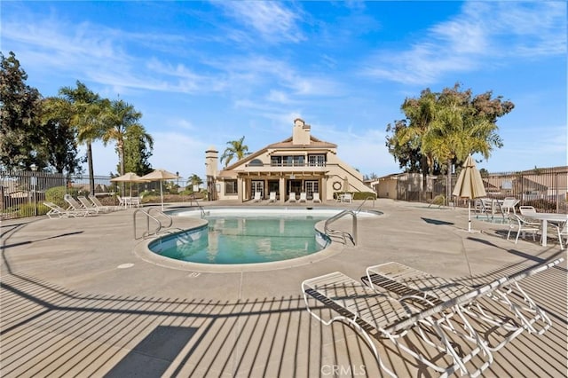 view of swimming pool with a patio area