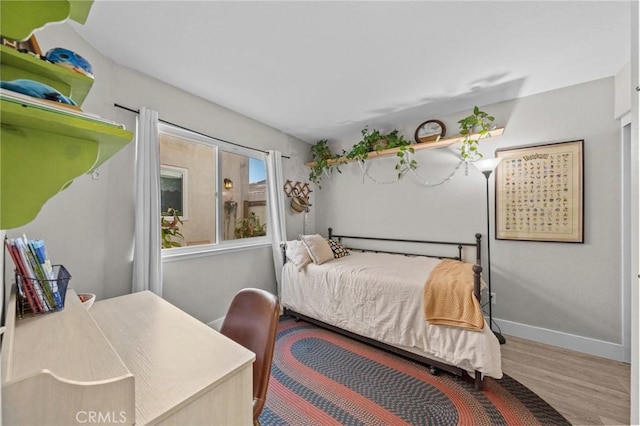 bedroom featuring wood-type flooring