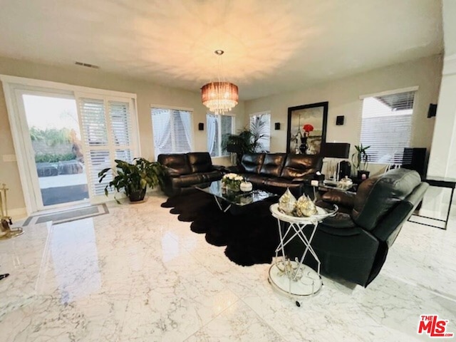 living room featuring a chandelier