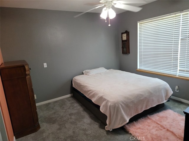 bedroom featuring ceiling fan and carpet