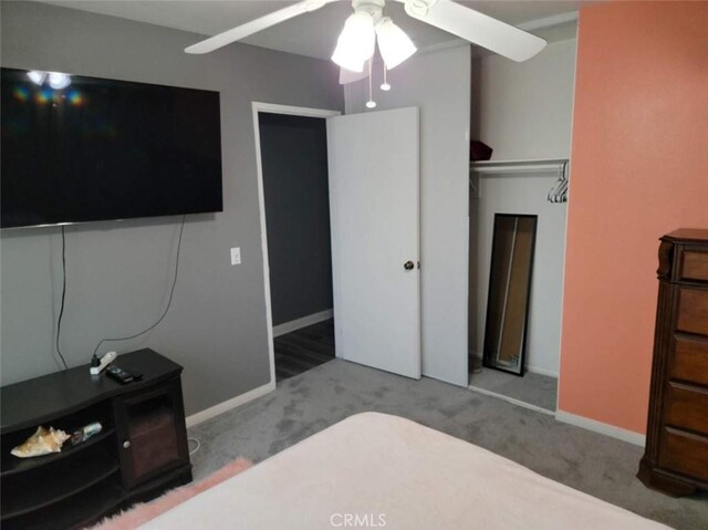 bedroom featuring ceiling fan, a closet, and carpet