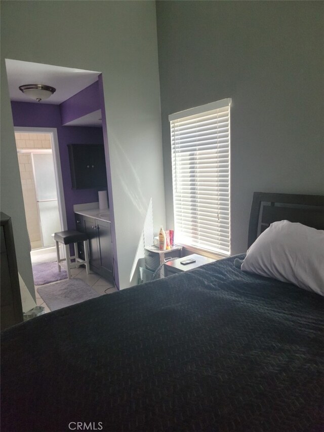 bedroom featuring light tile patterned floors