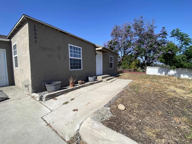 rear view of property featuring a patio area