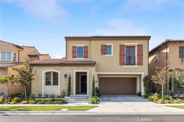 mediterranean / spanish-style home featuring a garage