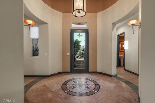 foyer entrance with an inviting chandelier