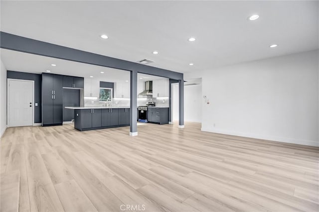 unfurnished living room with light wood-type flooring