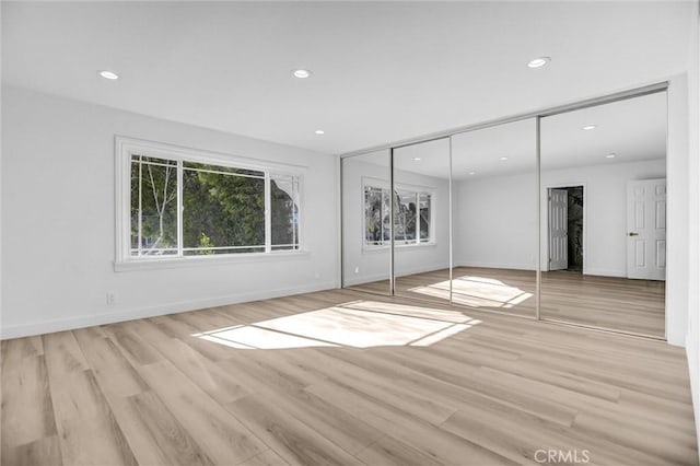 unfurnished room featuring light hardwood / wood-style floors