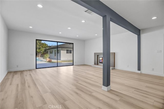 unfurnished living room featuring light hardwood / wood-style flooring