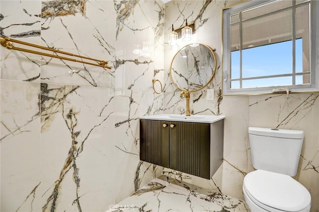 bathroom with toilet and vanity