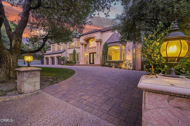 mediterranean / spanish-style house featuring a garage