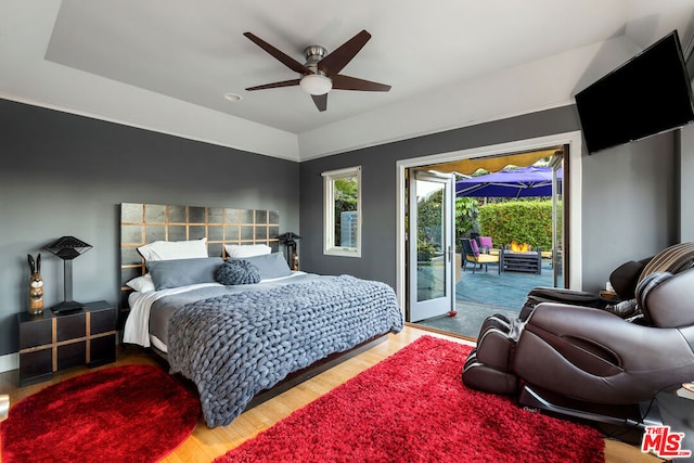 bedroom featuring access to exterior, ceiling fan, and light hardwood / wood-style flooring