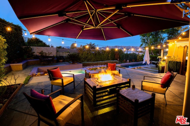 view of patio / terrace featuring a fire pit and a fenced in pool