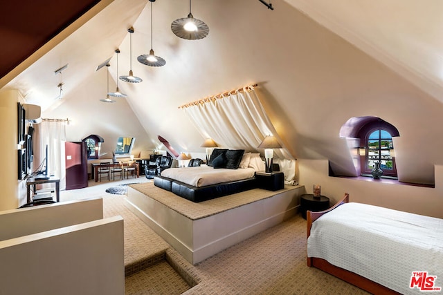 carpeted bedroom with high vaulted ceiling