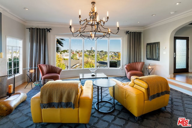 living room featuring ornamental molding and a notable chandelier