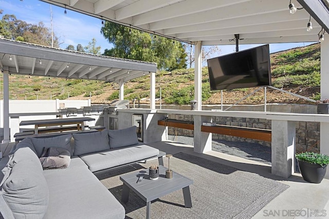 view of patio / terrace featuring an outdoor hangout area, exterior kitchen, and grilling area