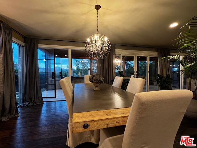 dining space with french doors, an inviting chandelier, and dark hardwood / wood-style floors