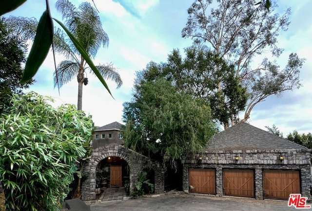 exterior space with a garage