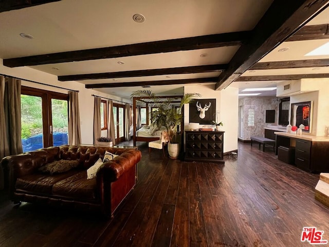 living room with beamed ceiling and dark hardwood / wood-style floors