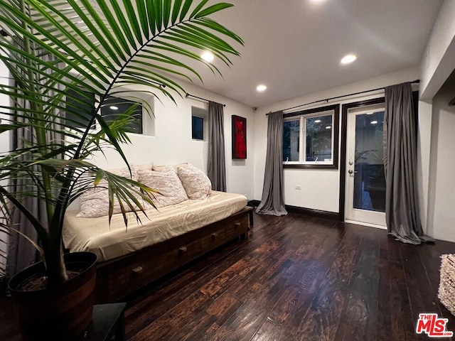 sitting room featuring dark wood-type flooring