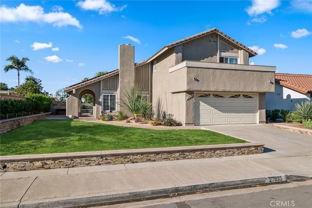 view of front facade featuring a front lawn and a garage