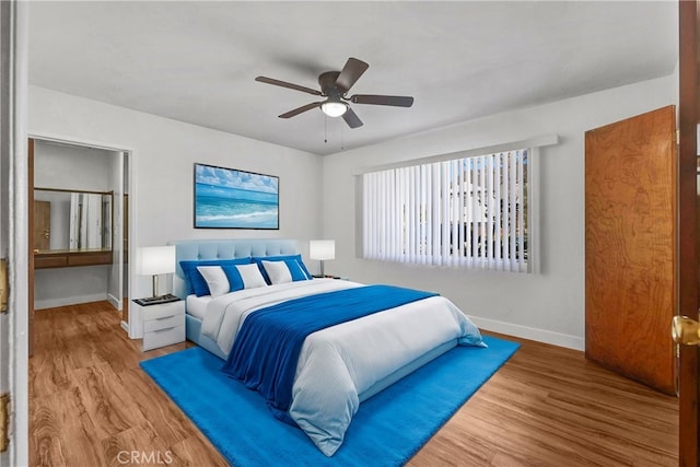 bedroom with ceiling fan and hardwood / wood-style flooring