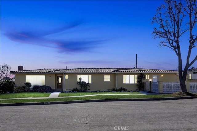 view of front of home with a yard