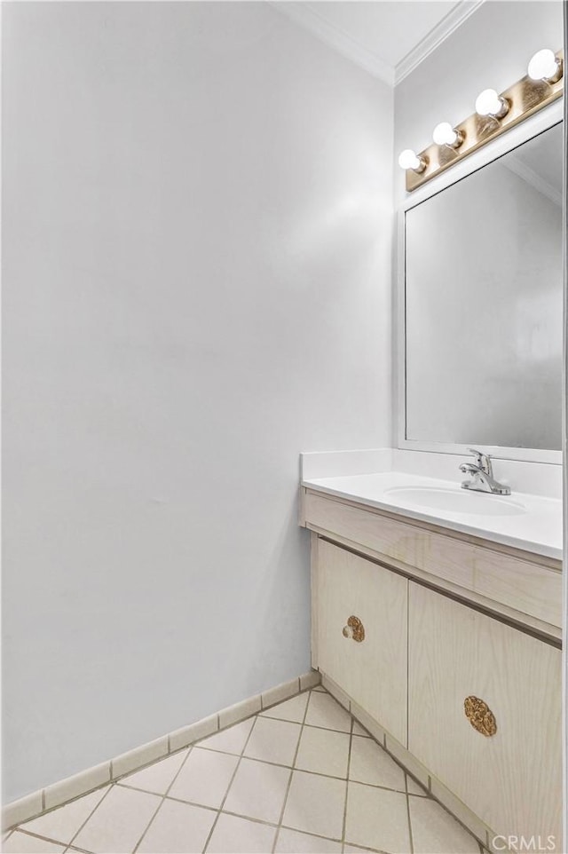 bathroom featuring ornamental molding, tile patterned floors, and vanity