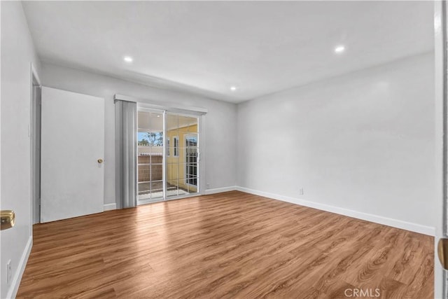 spare room featuring hardwood / wood-style flooring