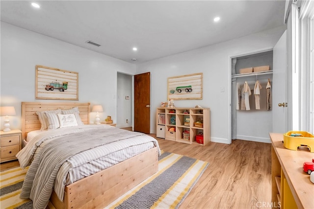 bedroom featuring a closet and light wood-type flooring