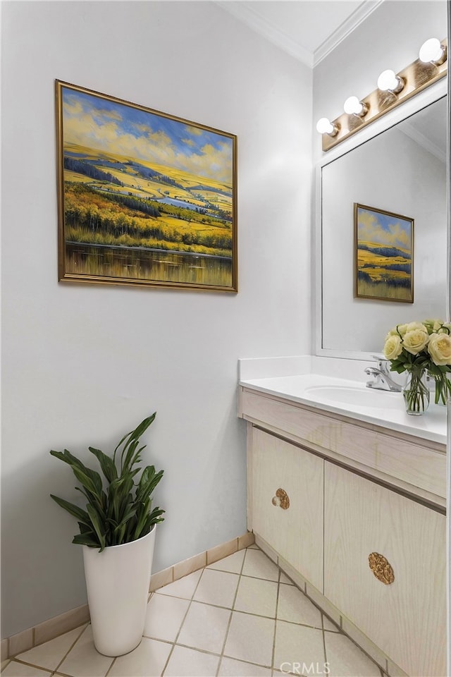 bathroom with ornamental molding, tile patterned floors, and vanity