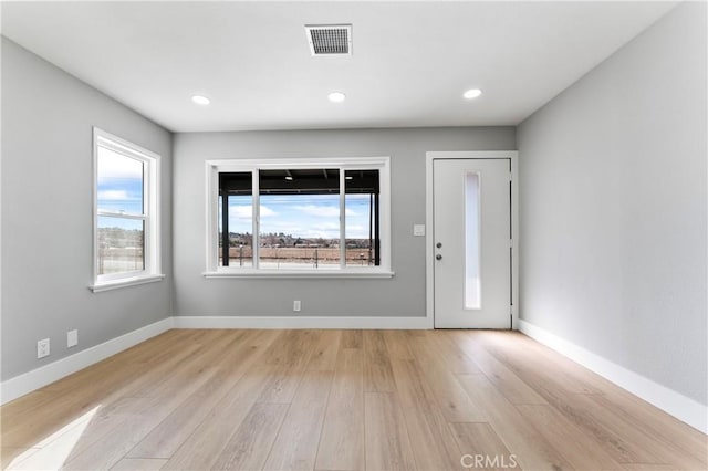 entryway with light hardwood / wood-style floors