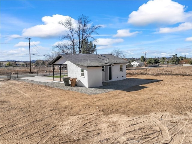 rear view of property featuring a patio area