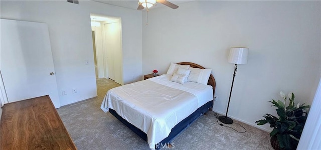 bedroom featuring dark colored carpet and ceiling fan