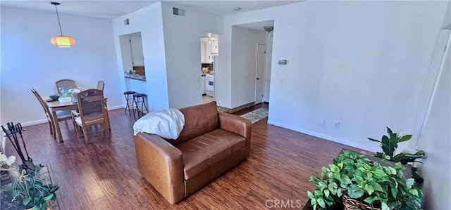 living room with dark wood-type flooring