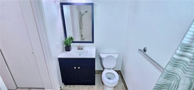 bathroom featuring toilet, a shower with curtain, tile patterned floors, and vanity