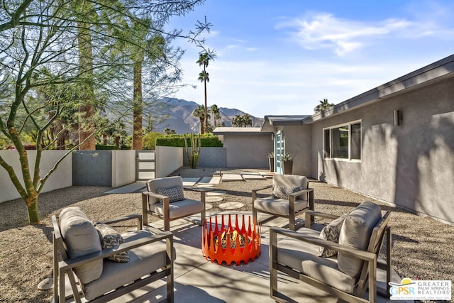 view of patio / terrace featuring a mountain view and outdoor lounge area