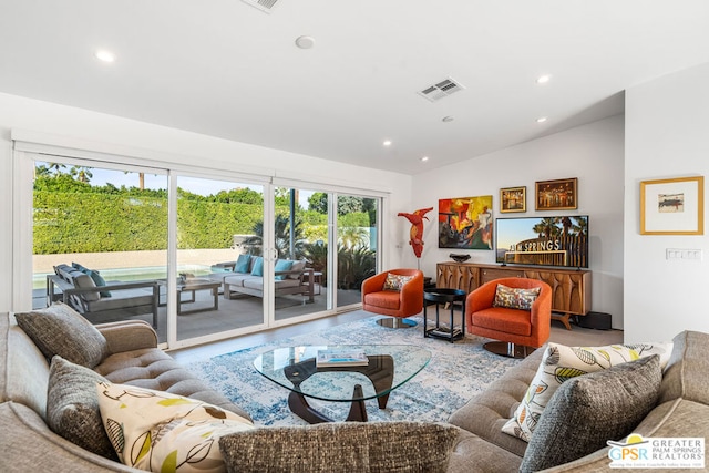 living room with lofted ceiling