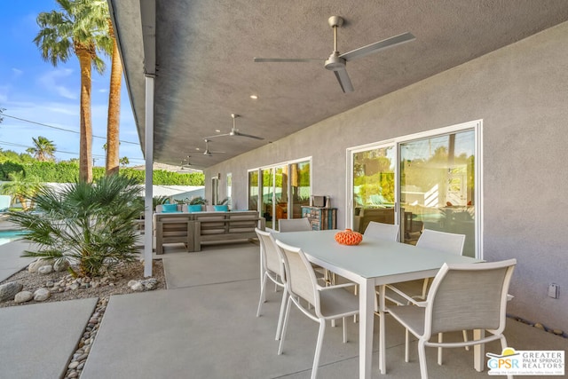 view of patio with ceiling fan and an outdoor living space