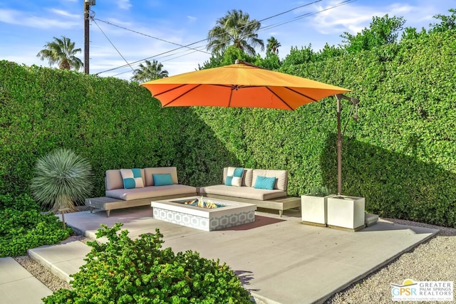 view of patio / terrace featuring an outdoor living space with a fire pit