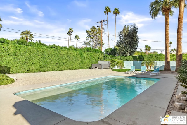 view of swimming pool featuring a patio area and a jacuzzi