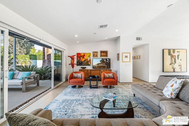 living room featuring vaulted ceiling