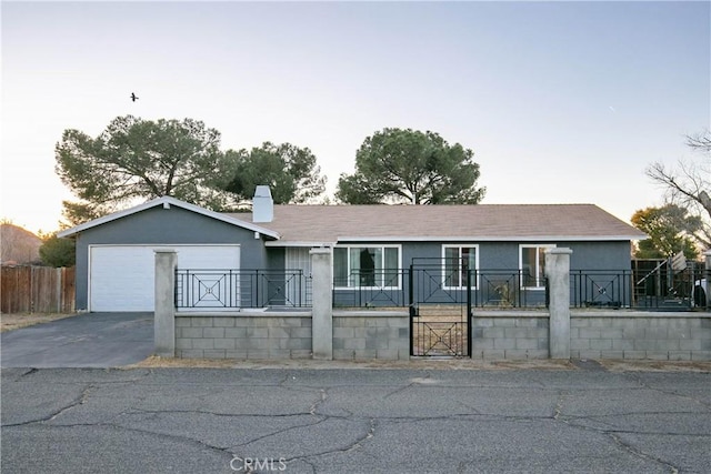 ranch-style house featuring a garage