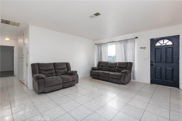 living room with light tile patterned flooring