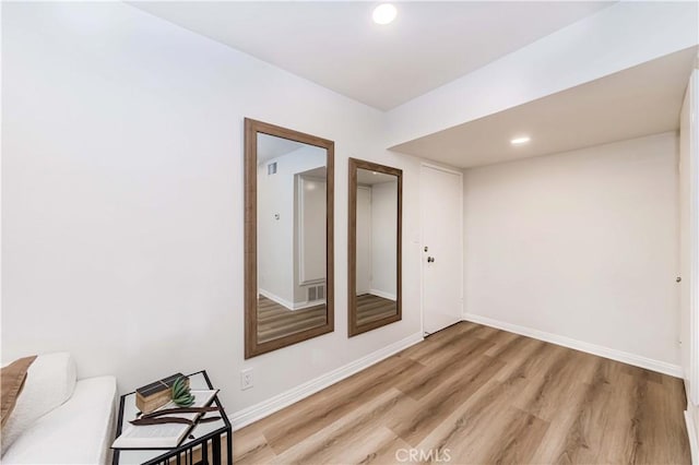 spare room with light wood-type flooring